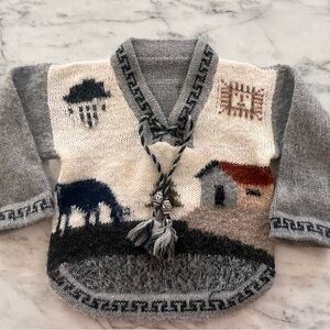 Gray and White Knit Sweater with Tassels and Patterns